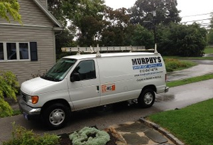 White Murphy's Dryer Vent Service van shown from the side. Van reads: Murphy's dryer vent service LLP, clean, repair, install